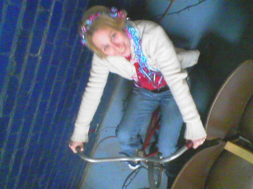 Sarah riding a trike