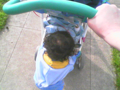 Lucas is a big boy helping me push the stroller.