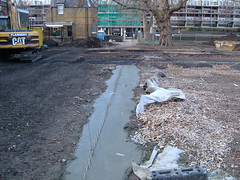 Concrete setting in the ball court trench