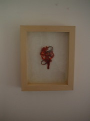 red bead thing framed